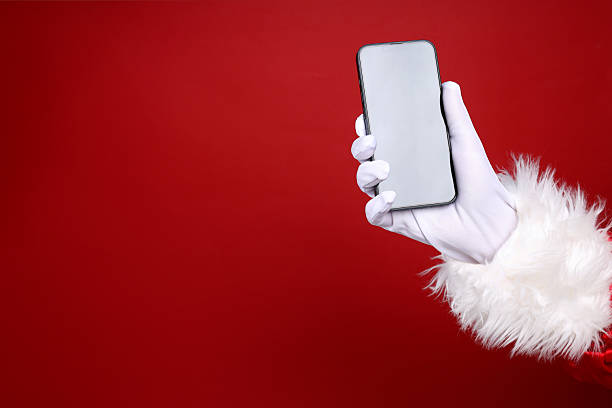 istock New year concept, Santa's hand with smartphone 2240711817