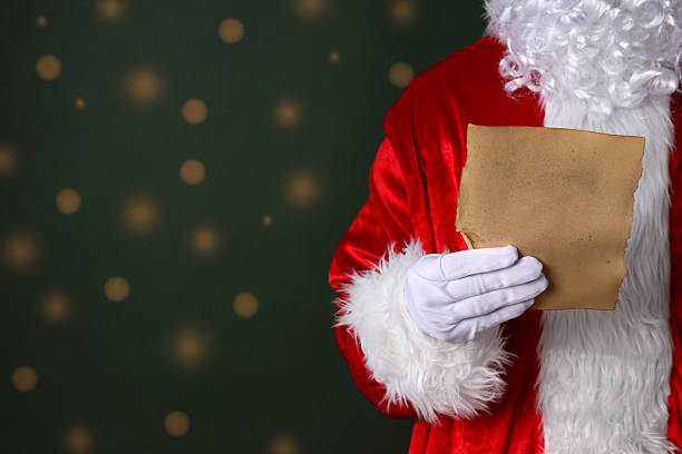 istock New year concept, Santa's hand with an envelope 2240712940