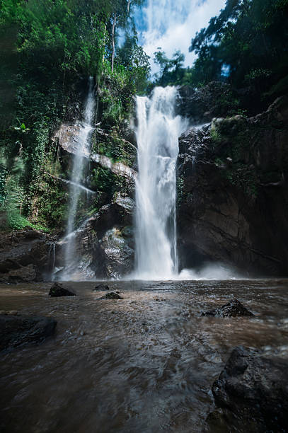 istock Stunning Waterfall in Chiang Mai Surrounded by Lush Greenery 2240713097