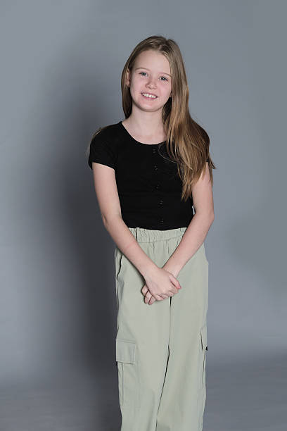 istock A naturally joyful girl beams with happiness during a casual studio shoot. Such authentic expressions underline the significance of nurturing genuine happiness in children's daily lives. 2240714140