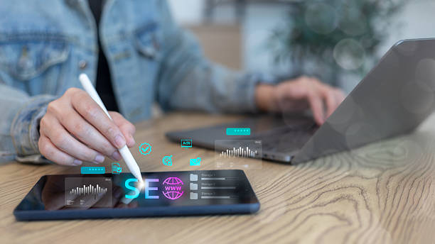 istock Businessperson using tablet for SEO optimization, digital marketing, and website analytics. Concept of online advertising, data analysis, and technology strategy. 2240714768