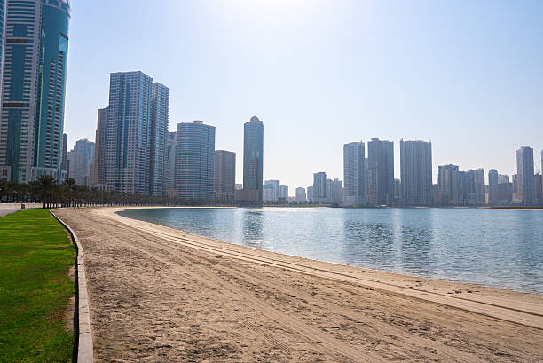 istock Sandy shoreline with modern city skyline 2240715223
