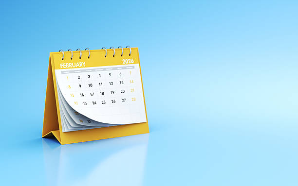 istock February 2026 Yellow Realistic Desk Calendar on Blue Endless Background 2240719135