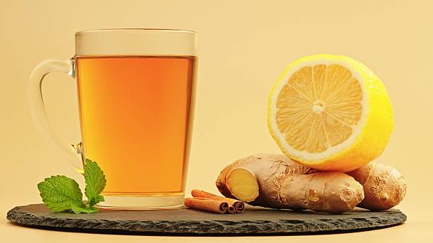 istock Fresh herbal tea with ginger, lemon, mint and cinnamon on a slate board 2240719654