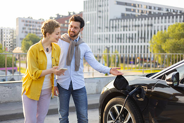 istock Couple Charging Electric Car 2240719927