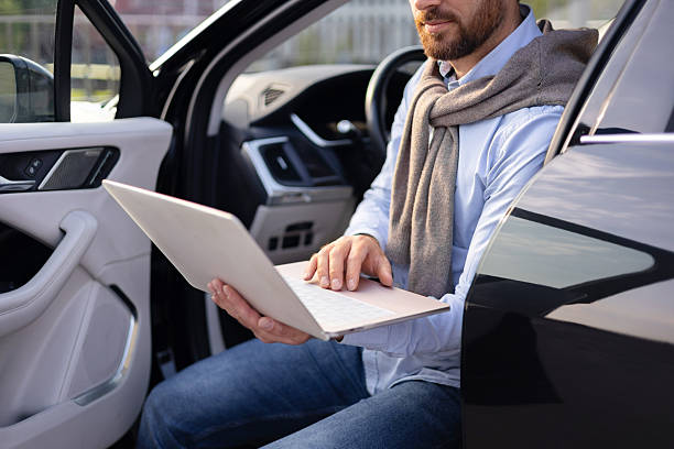 istock Man Working on Laptop in Car 2240719999