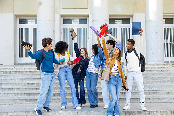 istock Diverse students celebrating college graduation day achievement 2240724077
