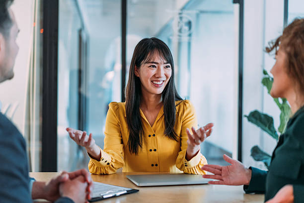 istock Group of business persons talking in the office. 2240725023