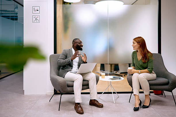 istock Business colleagues collaborating in a modern office lounge area 2240725265