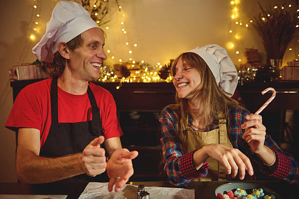 istock Happy Chefs Share Holiday Joy In Cozy Kitchen As They Bake And Laugh 2240728022