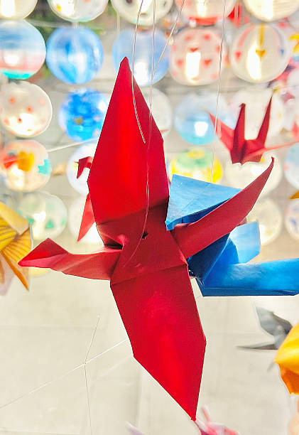 istock Hanging Red Origami Crane Paper Bird 2240728579