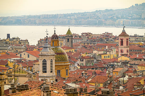 View on Nice from Castle Hill (Colline du Château), France with the Nice Cathedral (Basilique-Cathédrale Sainte-Marie et Sainte-Réparate de Nice) during a summer day.