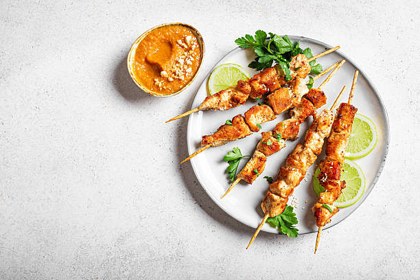 istock Malaysian chicken satay skewers with peanut sauce 2240736934