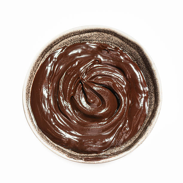 istock Bowl of melted dark chocolate isolated 2240737019