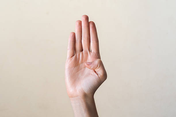 istock A close-up of a human hand with fingers extended, palm facing forward. The hand is light-skinned with visible details of the fingers and palm. 2240737634