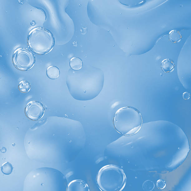 istock Clear blue background with glossy floating bubbles, creating a refreshing and clean abstract texture. abstract designs and shapes 2240738971