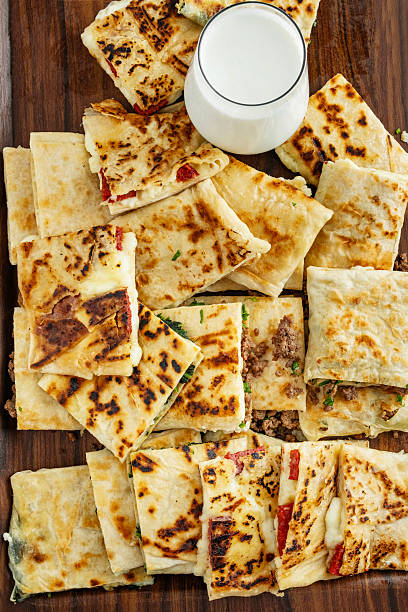 Turkish Traditional Gozleme / Pancake. Traditional Turkish flatbread or Gozleme. Breakfast. Turkish sausage Gozleme. "Gözleme or bazlama" which is a traditional Turkish stuffed flat bread. Gözleme varieties.