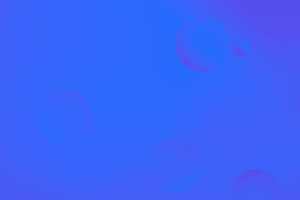 Minimal gradient background in violet and blue with subtle floating oil droplets, abstract and modern design.