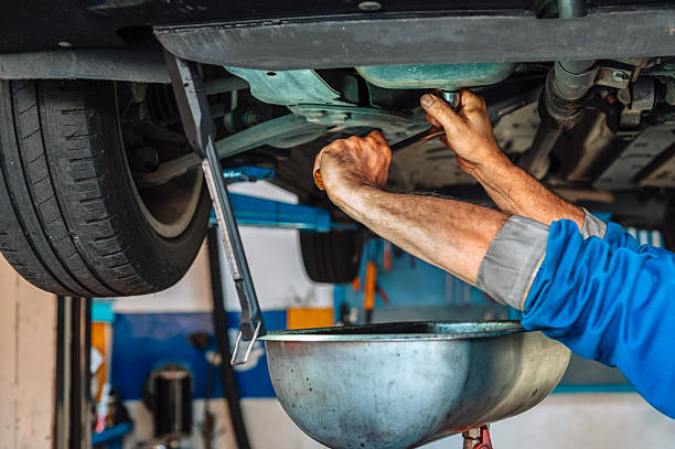 istock Mechanic changing car engine oil during service 2240742984