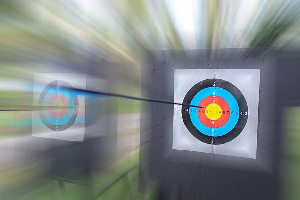 istock Arrow in Fast Motion Blur Hitting the Archery Target Bullseye 2240743434
