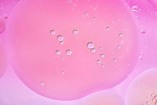 istock Macro abstract, large and small pink bubbles in water create a soft minimalist background. Smooth color transitions, simple structure, horizontal format. 2240745812