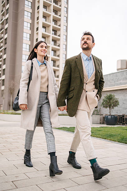 istock Successful couple walking in modern residential area 2240749734
