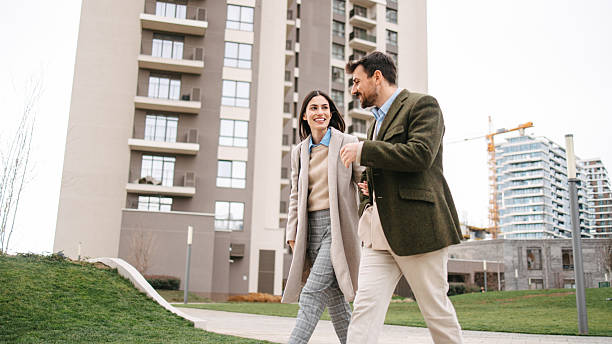 istock Modern business couple walking through residential district 2240749748