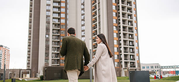 istock Modern business couple walking through residential district 2240749752