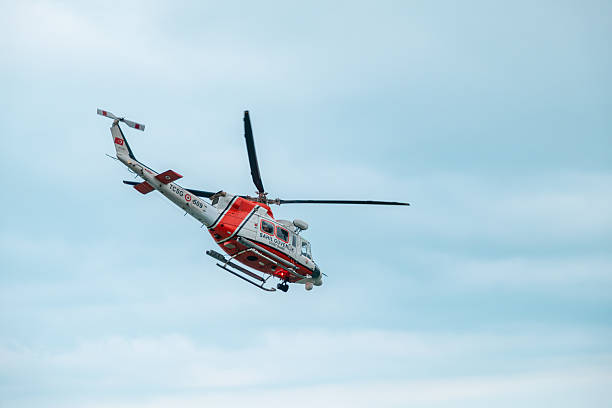 paramedics preparing rescue helicopter for take off, Bernese Oberland Switzerland, Lenklypse 2012
