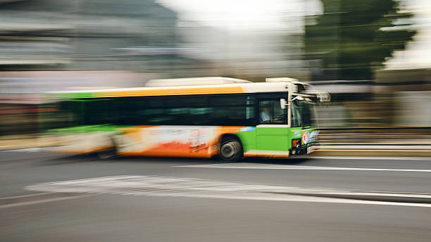 Tokyo, Japan - October 13, 2025: A Toei non-step bus passing through an intersection in Ojima City, Koto Ward, Tokyo Japan.
