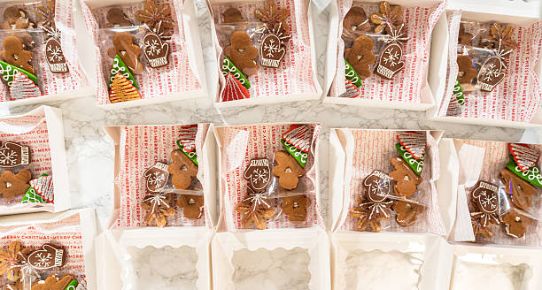 istock Packing Gingerbread Cookies in Holiday Gift Boxes 2240753969