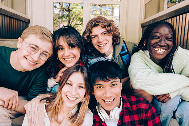 istock Diverse group of smiling students enjoying break time together 2240754290