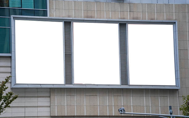 istock triple blank billboards and high rise business building for advertisement 2240756614