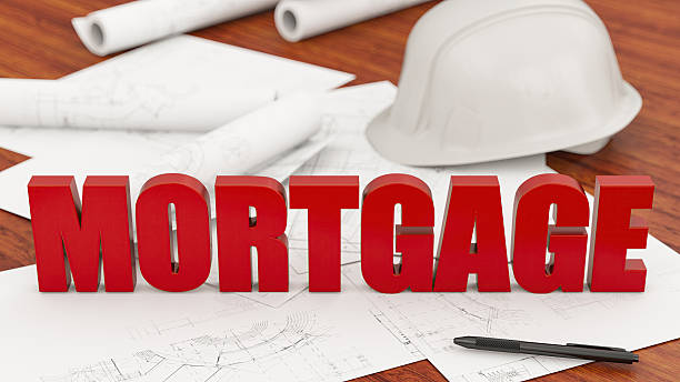 istock Red MORTGAGE Text on Architectural Blueprints with a Hard Hat 2240757823