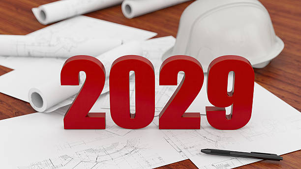 istock Red 2029 Numbers on Blueprints, Construction Plans, and Safety Helmet 2240759701