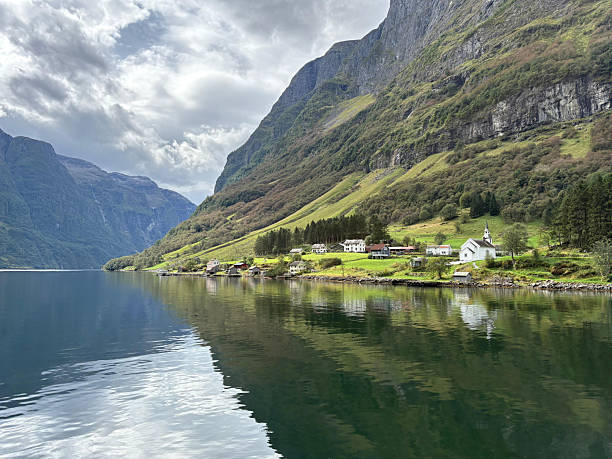istock Stunning Norwegian Fjord with Sheer Cliffs and Water Reflection 2240762472