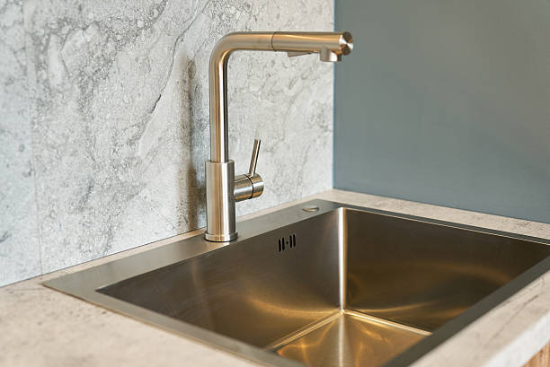 istock Stylish modern kitchen sink with a shiny faucet. 2240762996