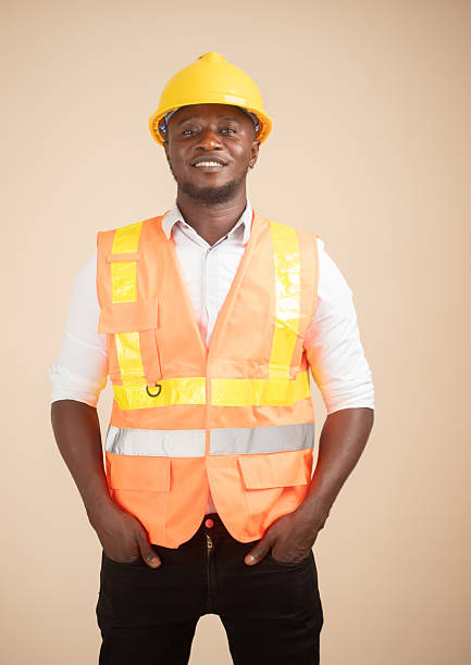 istock African Engineer in Hi-Vis Vest, Hands in Pockets 2240763097