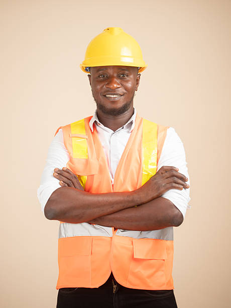 istock Smiling African Engineer in Hi-Vis Vest and Hardhat 2240763098