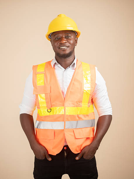 istock African Engineer in Hi-Vis Vest and Yellow Hardhat 2240763255