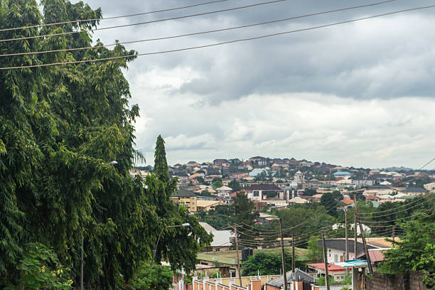istock Panoramic Enugu skyline with hillside homes under cloudy sky, Nigeria 2240764584