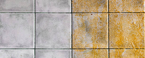 istock Tiles on the kitchen wall. Tiled wall half clean and half dirty, with a striking contrast. 2240764872