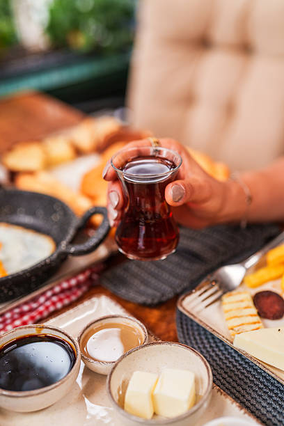 istock Hand Holding Traditional Turkish Tea Glass 2240766468
