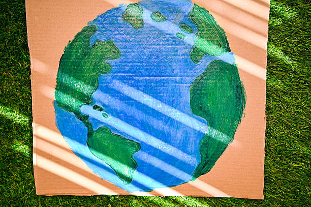 istock Drawing of planet earth on cardboard representing environment 2240766901