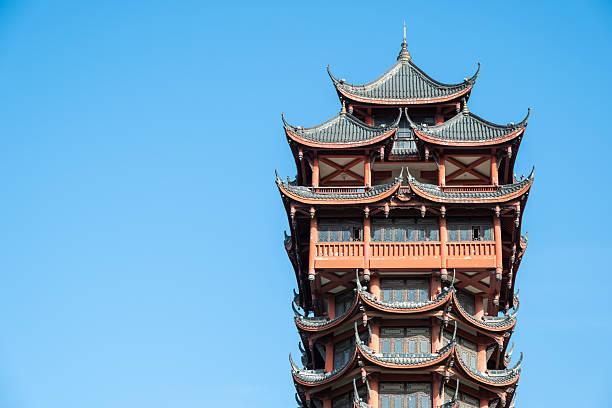 istock Elegant Red Chinese Pagoda Tower With Multi-Tier Roofs Under Bright Blue Sky 2240768916
