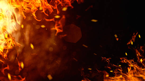 istock Dramatic red, orange, yellow flame and smoke rising against a dark background. Realistic, abstract fire burning background texture overlay. Vivid and hot hell or blazing fire wallpaper 2240772182