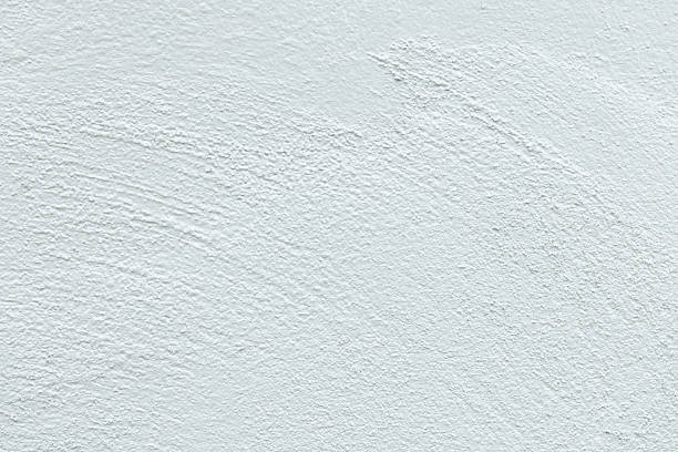 istock Close-up macro white concrete wall texture,Close-up image showcasing a white textured wall surface with subtle imperfections. Textured background with sharp photo details. Premium for background. 2240773524