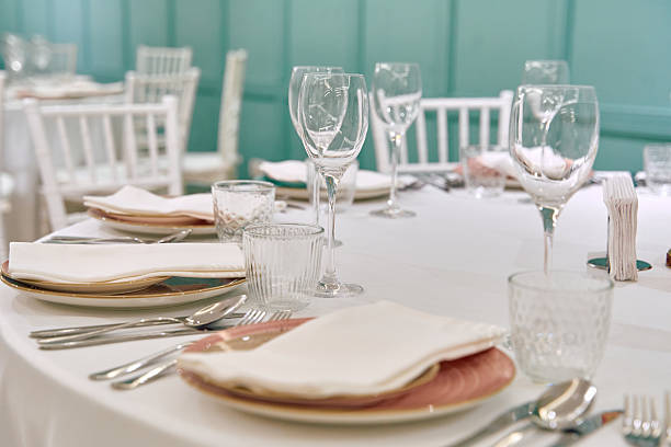 istock Elegant Dining Setting Featuring Tableware and Glasses Ready for a Special Occasion with Soft Lighting and Tasteful Decor 2240774100