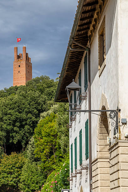 San Miniato's Rocca Federico II tower dominates the Tuscan hillside with an ancient building below