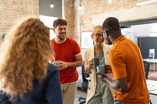 istock Diverse business colleagues laughing enjoying coffee break 2240779776